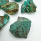Edge-on view of Chrysocolla raw stone, showing natural sheen.