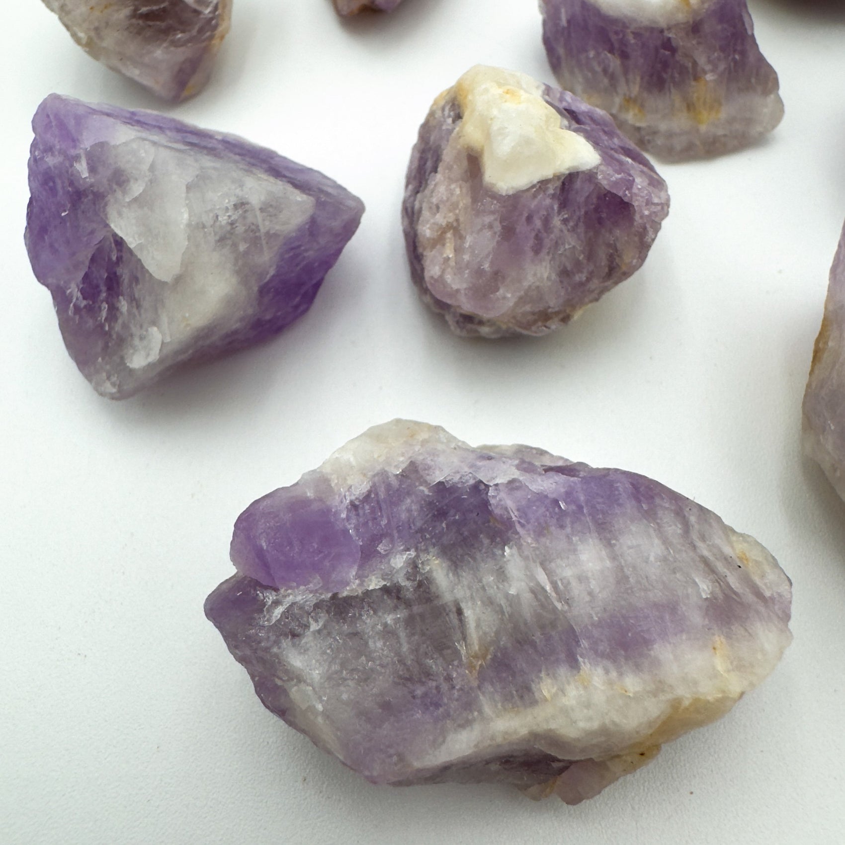 Side perspective of Amethyst raw stone, showing natural patina.