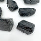 Back view of Grade AA Black Tourmaline raw stone, showing natural form, sourced from Vakinankaratra, Madagascar.