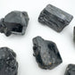 Daylight view of one Black Tourmaline raw stone for scale, Madagascar-sourced, from Vakinankaratra, Madagascar.