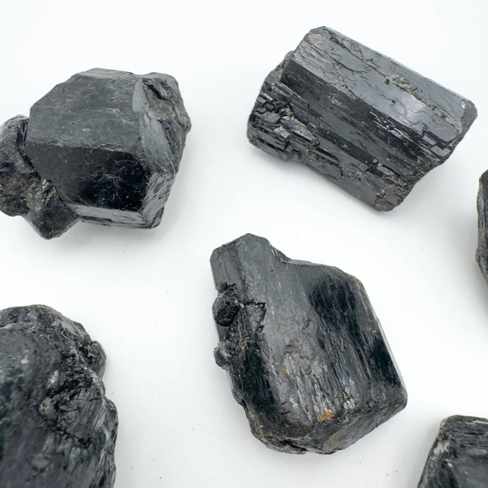 Daylight view of one Black Tourmaline raw stone for scale, Madagascar-sourced, from Vakinankaratra, Madagascar.