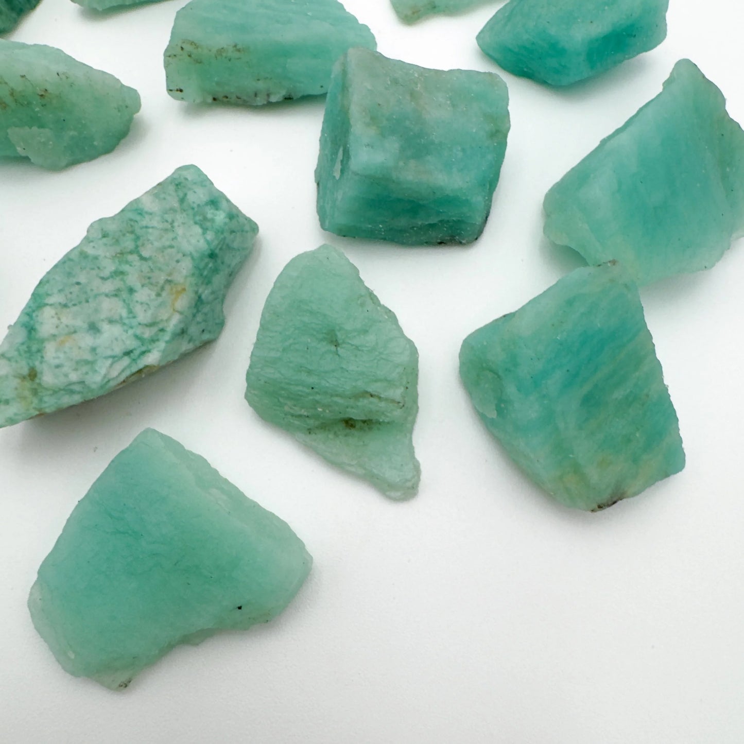 Side profile of Grade A Amazonite raw with natural form and inclusions