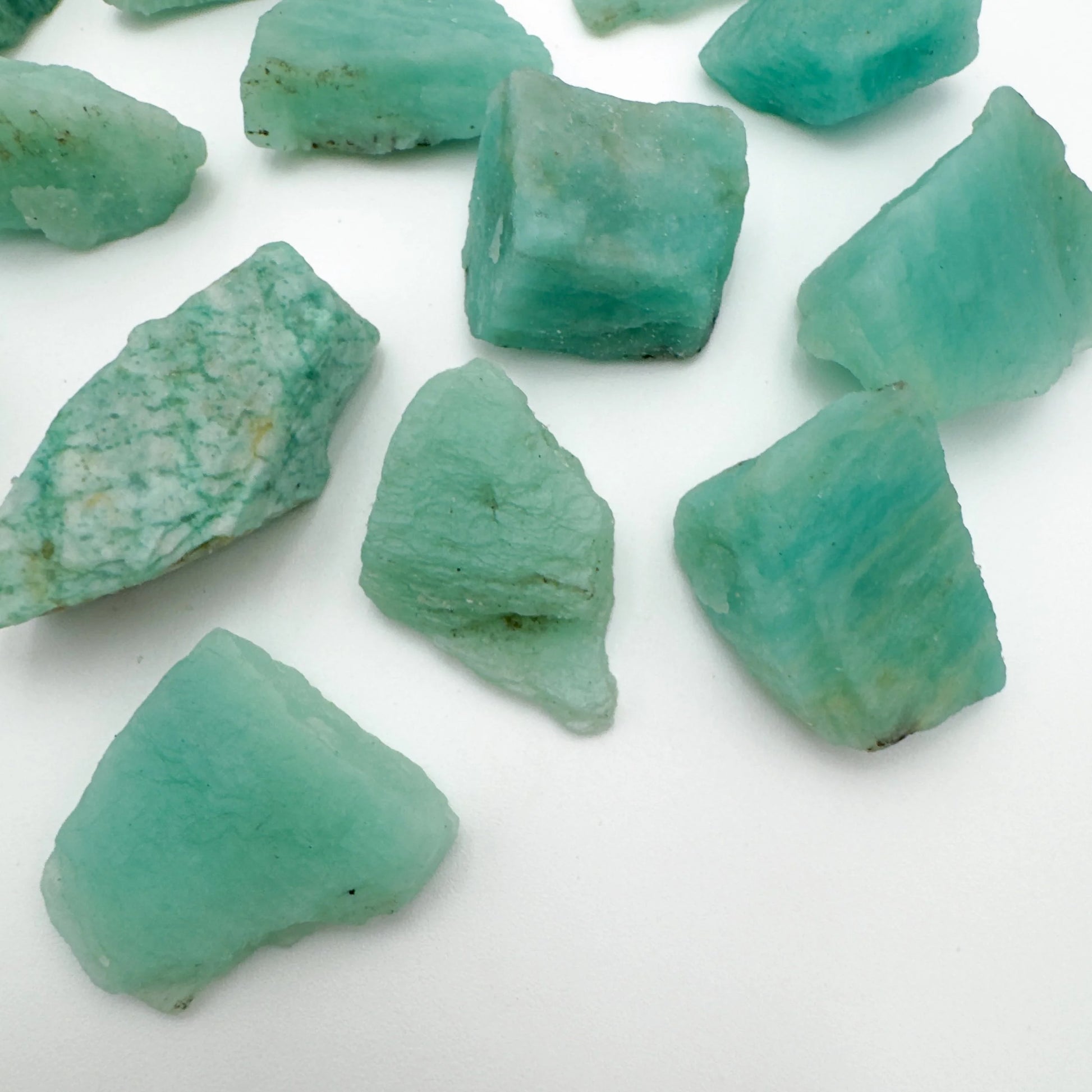 Side profile of Grade A Amazonite raw with natural form and inclusions