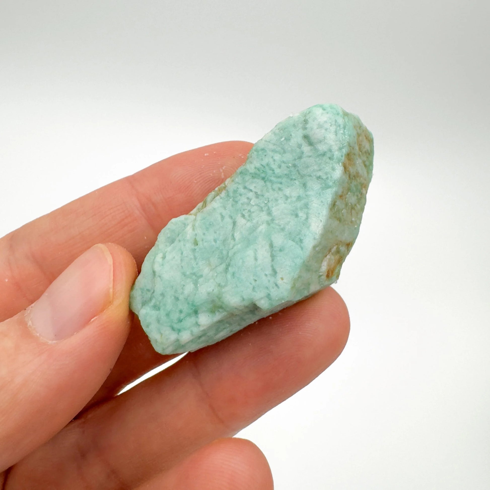 Back view of Grade A Amazonite raw showing natural surface