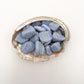 Detail capture of Grade A Blue Lace Agate tumbled stone, kept close for Stress Relief and Emotional Healing, Namibia-sourced.