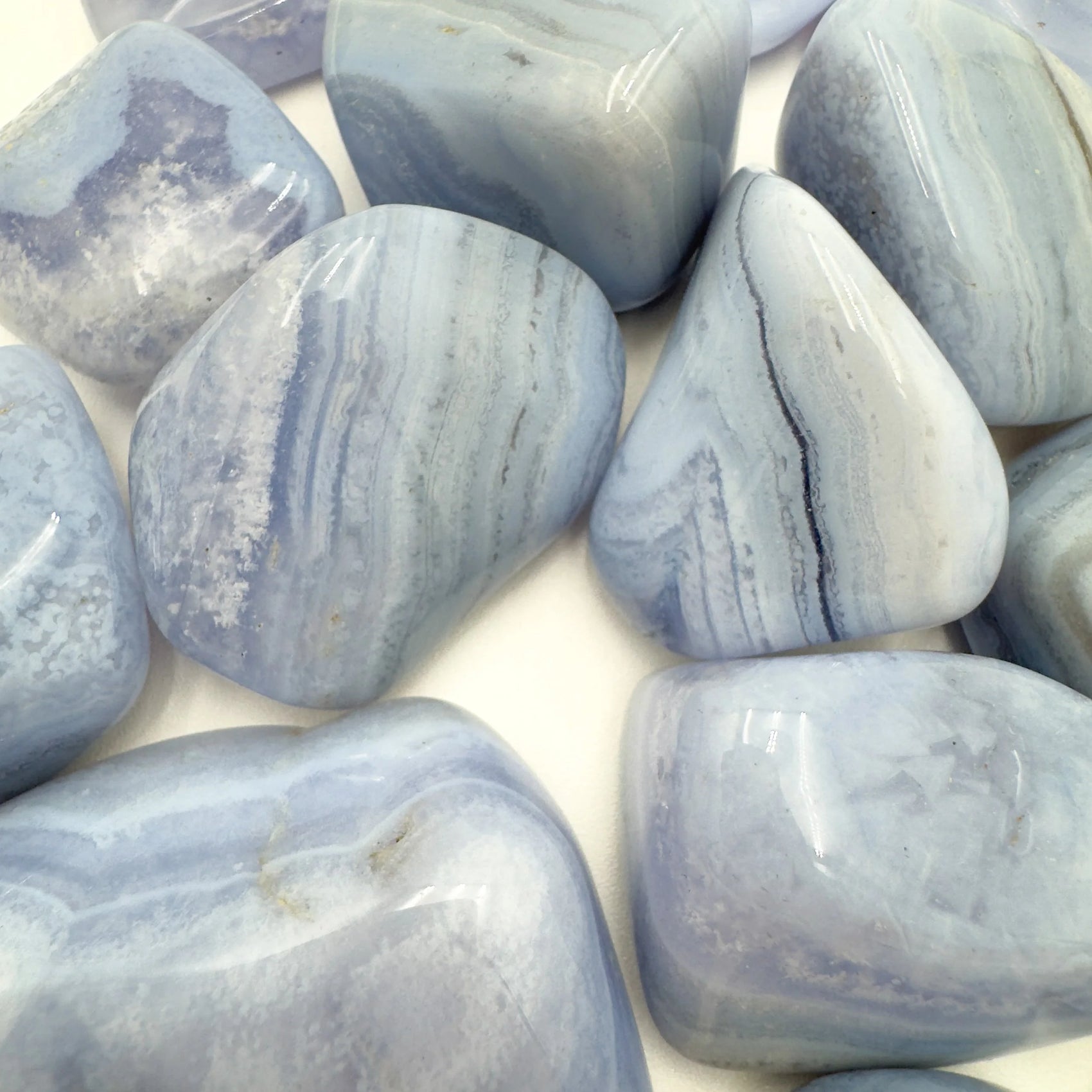 Top-side view of Grade A Blue Lace Agate tumbled stone, sourced from ǁKaras Region, Namibia.
