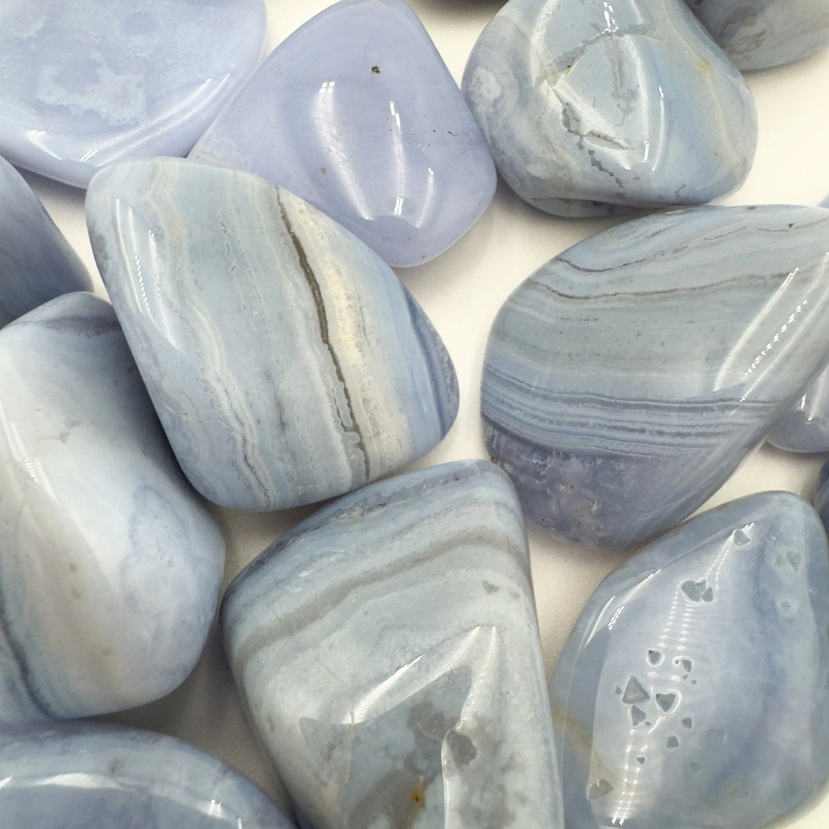 Bottom side of Grade A Blue Lace Agate tumbled stone, from ǁKaras Region, Namibia, for Stress Relief.