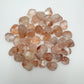 Texture-level view of Fire Quartz tumbled stone, from Madagascar.