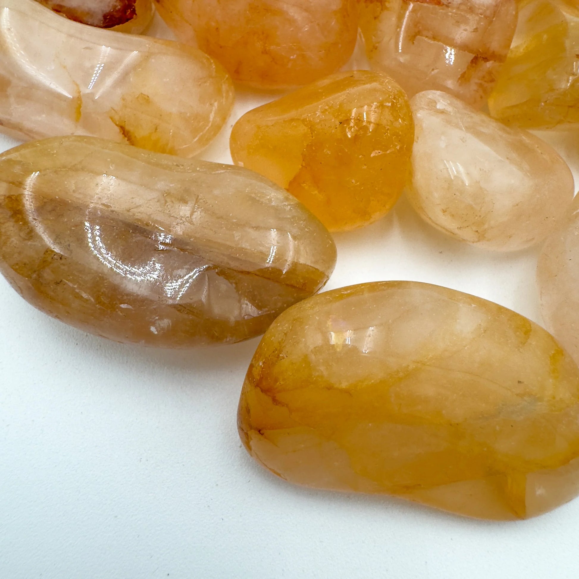 Sideways view of Golden Healer tumbled stone, sourced from Alaotra-Mangoro, Madagascar.
