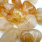 Bottom side of Golden Healer tumbled stone, sourced from Madagascar.