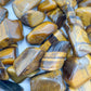 Soft-light view of Tiger Eye tumbled stone, from Northern Cape, South Africa, captured in soft, even lighting.