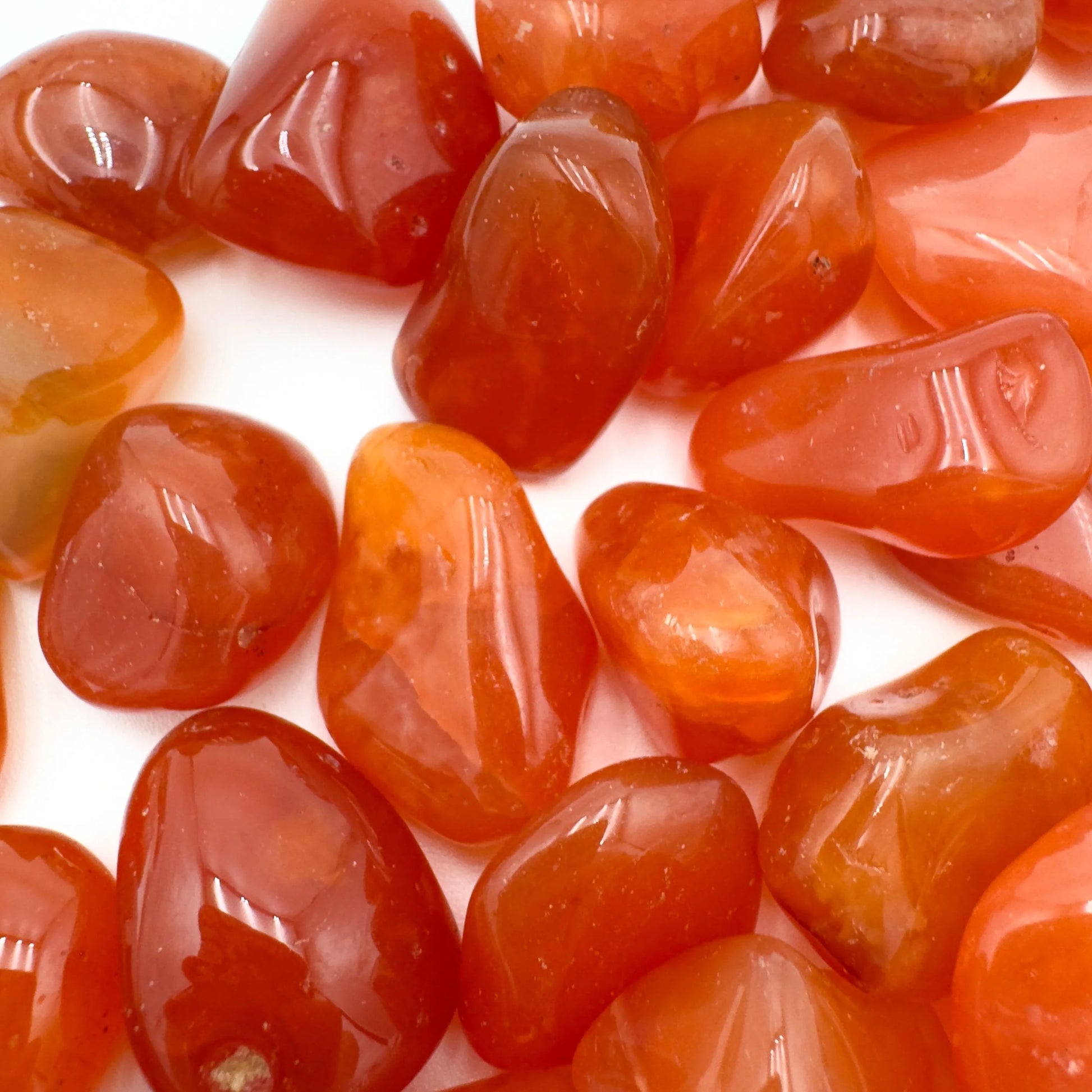 Alternate angle of Grade AA Carnelian tumbled stone showing overall shape