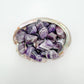 Grain detail of Chevron Amethyst tumbled stone, showing characteristic finish, from Copperbelt Province, Zambia.