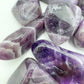 Reverse side of Grade AA Chevron Amethyst tumbled stone, showing matte finish.