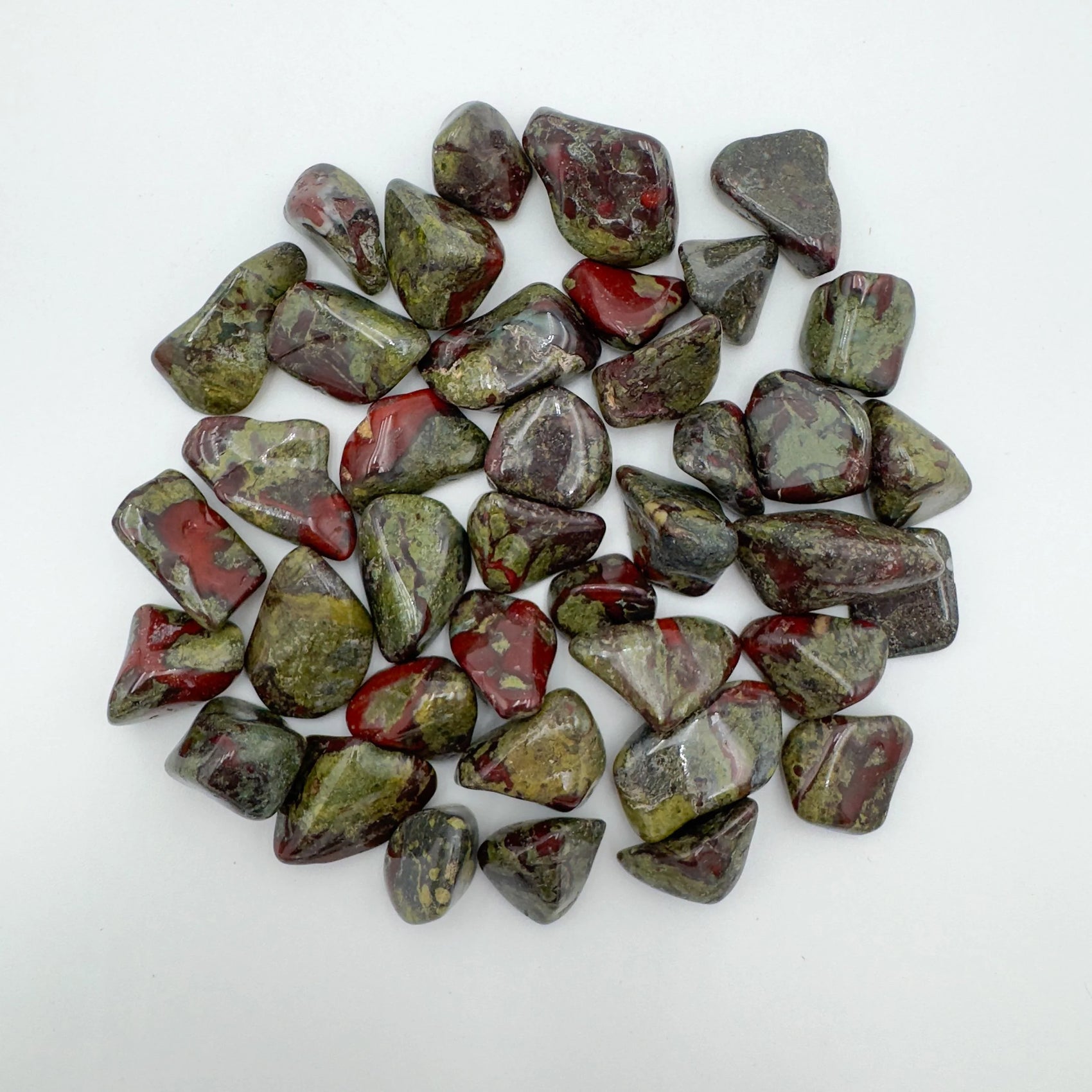 Close-up of Dragon Bloodstone tumbled stone from South Africa, soothing wellness stone for Energy