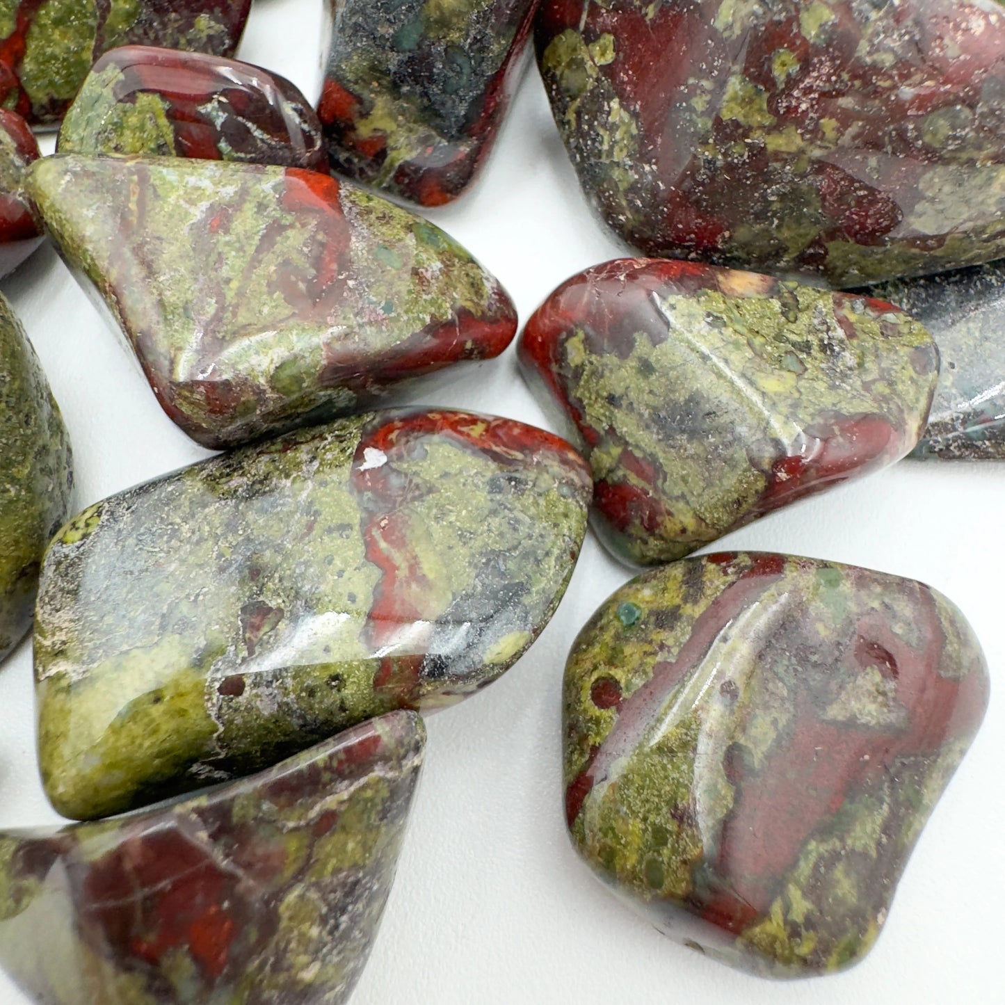 Back view of Dragon Bloodstone tumbled stone, from Limpopo, South Africa.