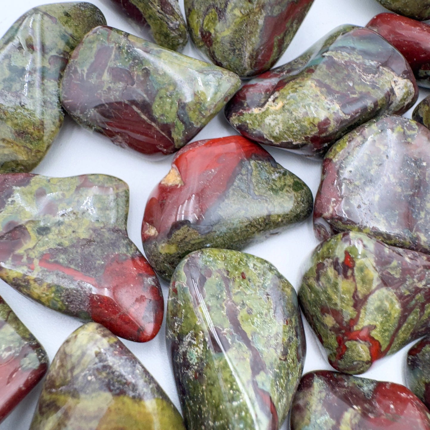 Aerial view of Grade AA Dragon Bloodstone tumbled stone, from Limpopo, South Africa.