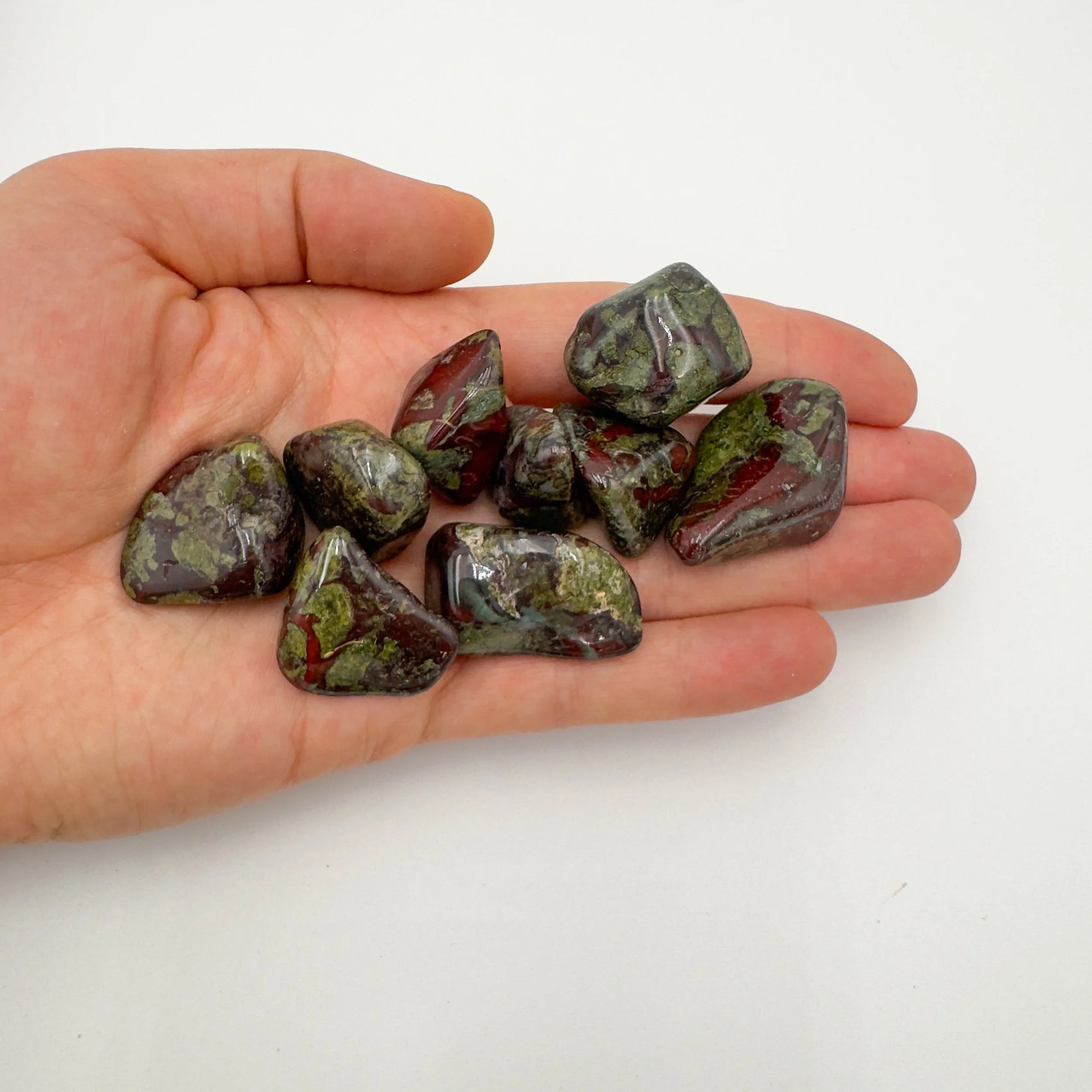 Close-up of Dragon Bloodstone tumbled stone from South Africa, soothing wellness stone for Energy