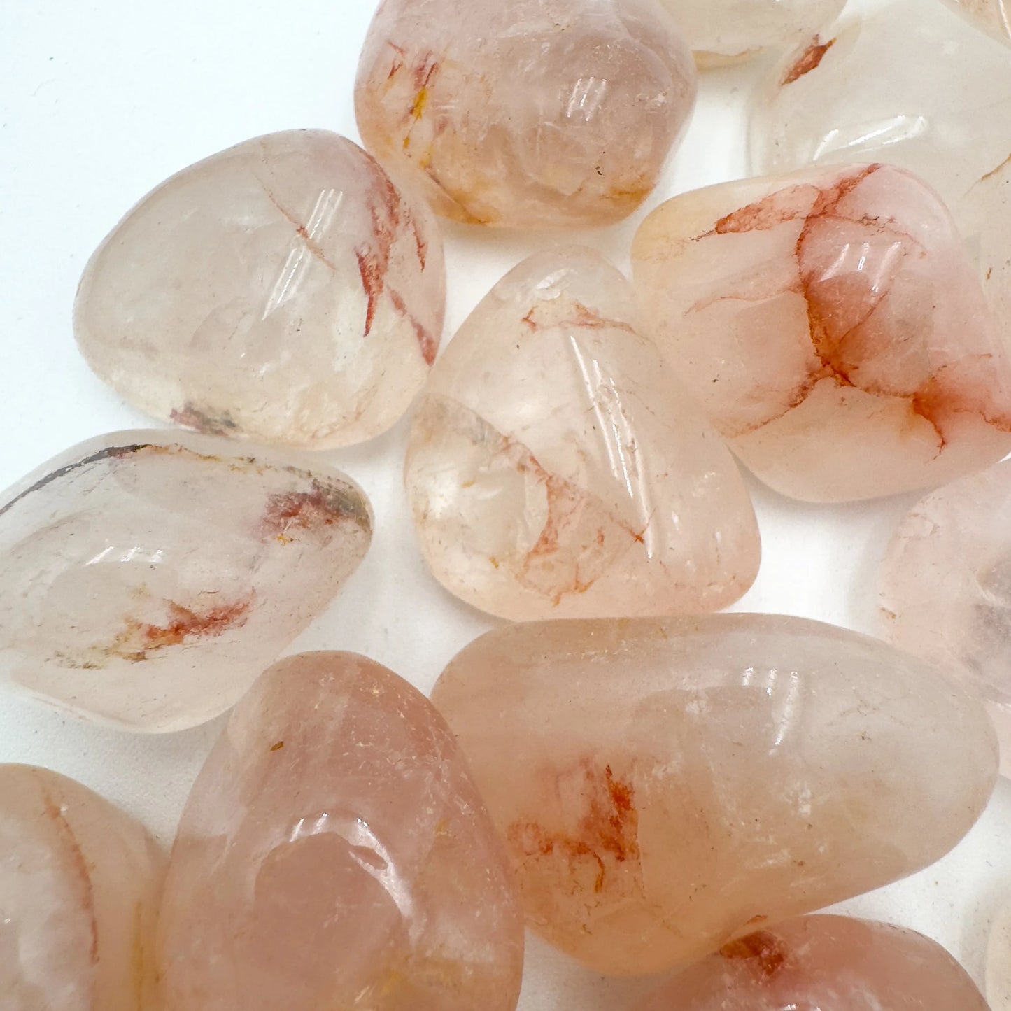 Plan view of Fire Quartz tumbled stone, showing characteristic color, hand-selected from Alaotra-Mangoro, Madagascar.