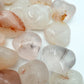 Size comparison with a Fire Quartz tumbled stone carried for Grounding, hand-selected from Alaotra-Mangoro, Madagascar.