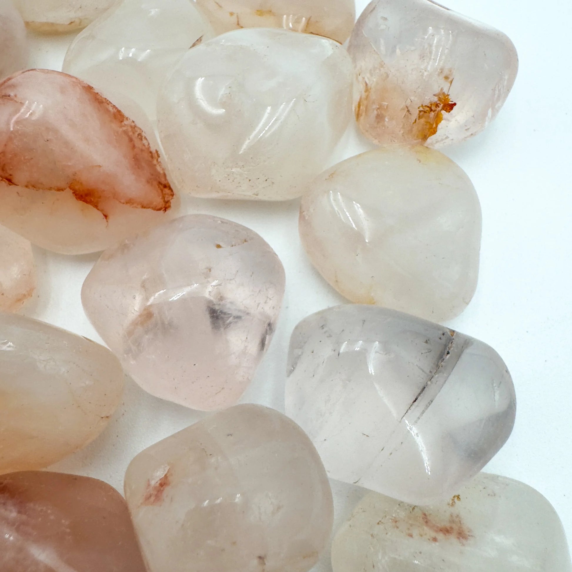 Size comparison with a Fire Quartz tumbled stone carried for Grounding, hand-selected from Alaotra-Mangoro, Madagascar.