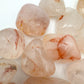 Lifestyle context of Fire Quartz tumbled stone, from Alaotra-Mangoro, Madagascar, shown for size reference.