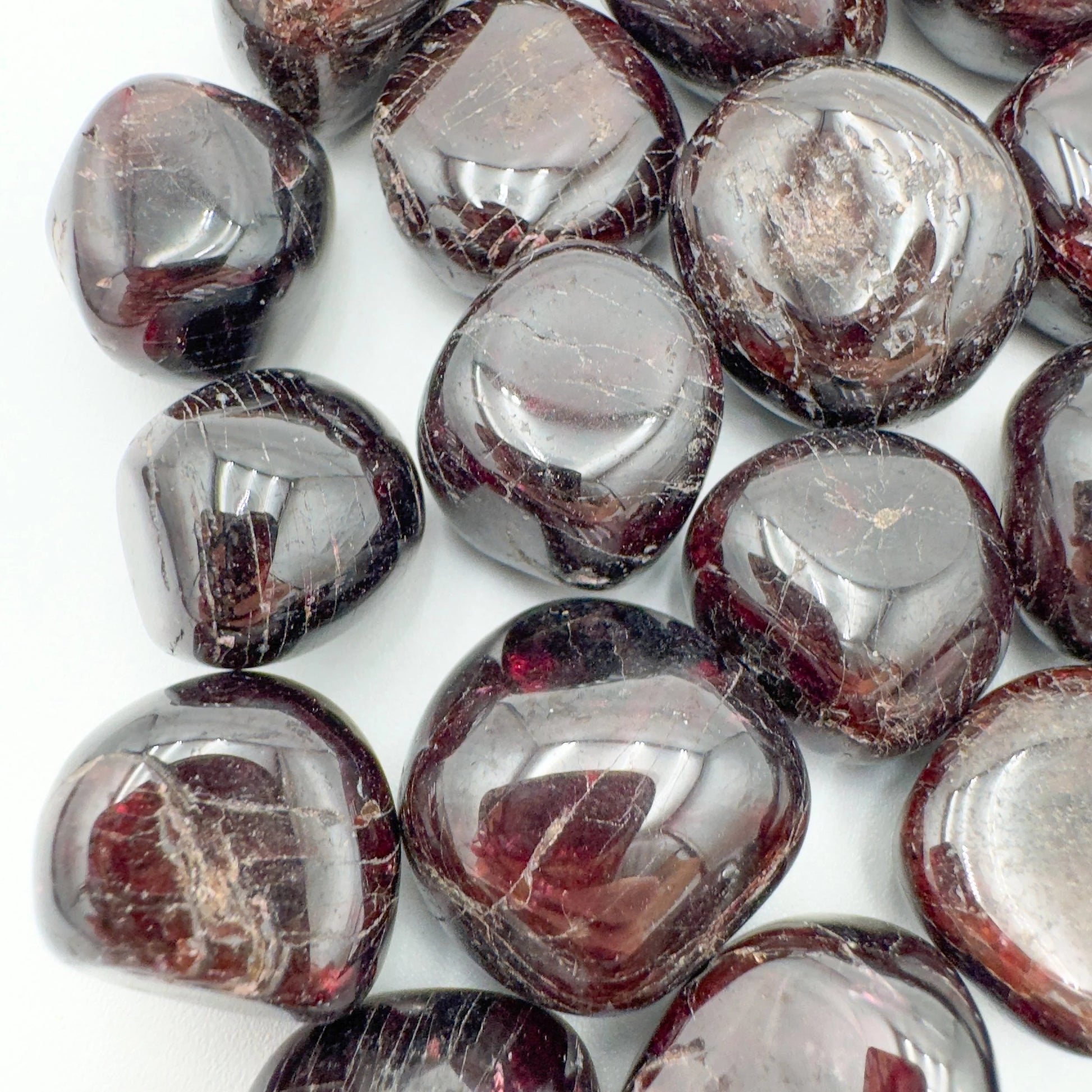 Underside view of Garnet tumbled stone, sourced from Malawi, to support Energy and Confidence.