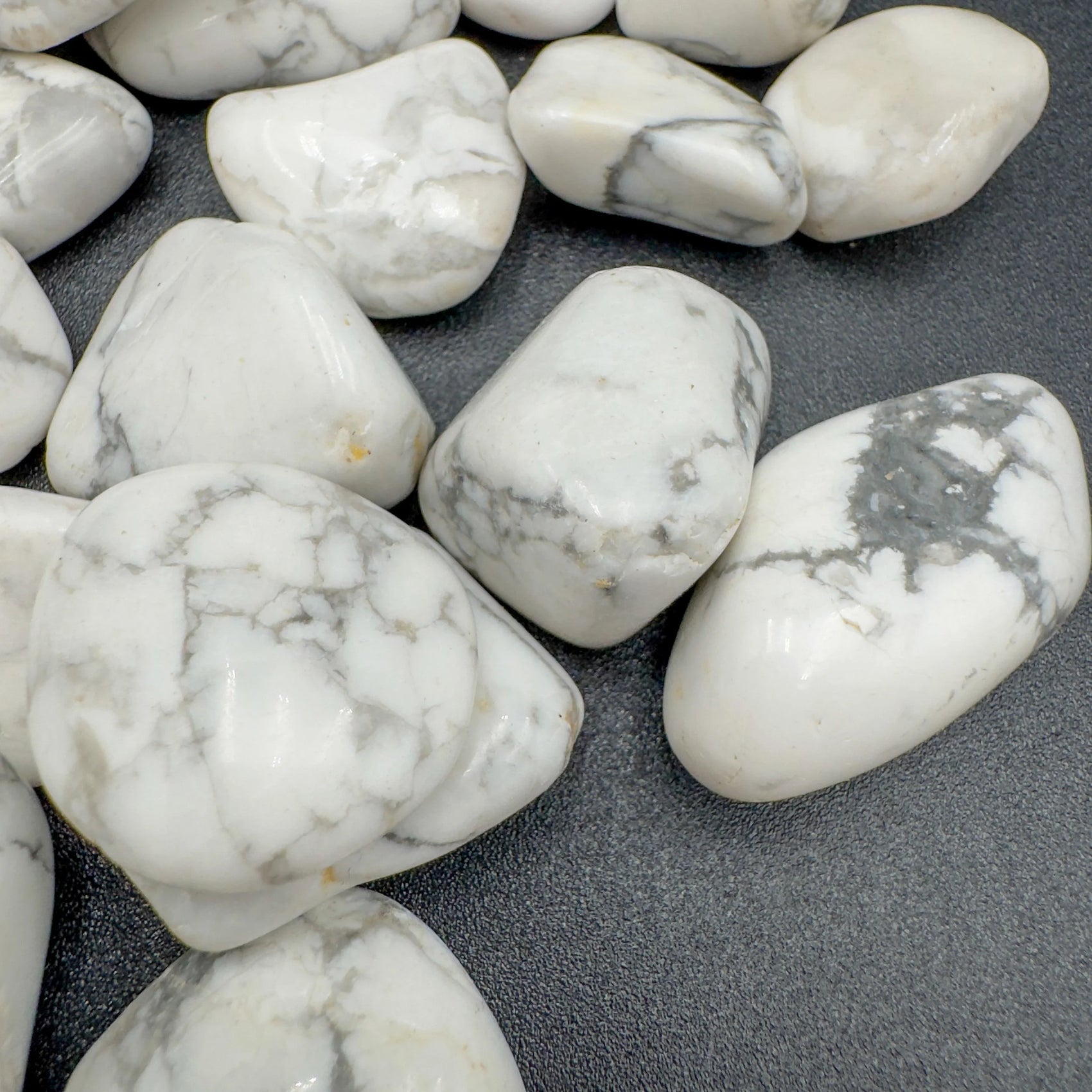 Overhead angle of Howlite tumbled stone, showing translucent edges, linked to Stress Relief.