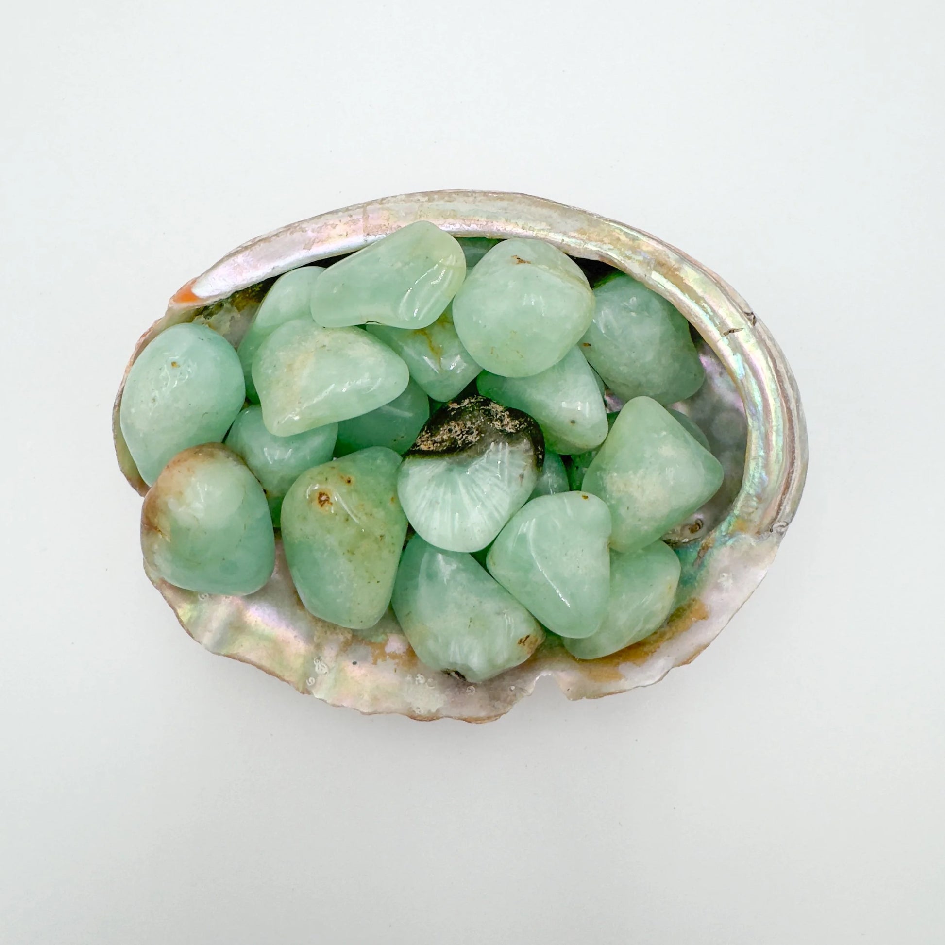 Surface detail of Prehnite tumbled stone, showing matte finish, to support Healing and Meditation.