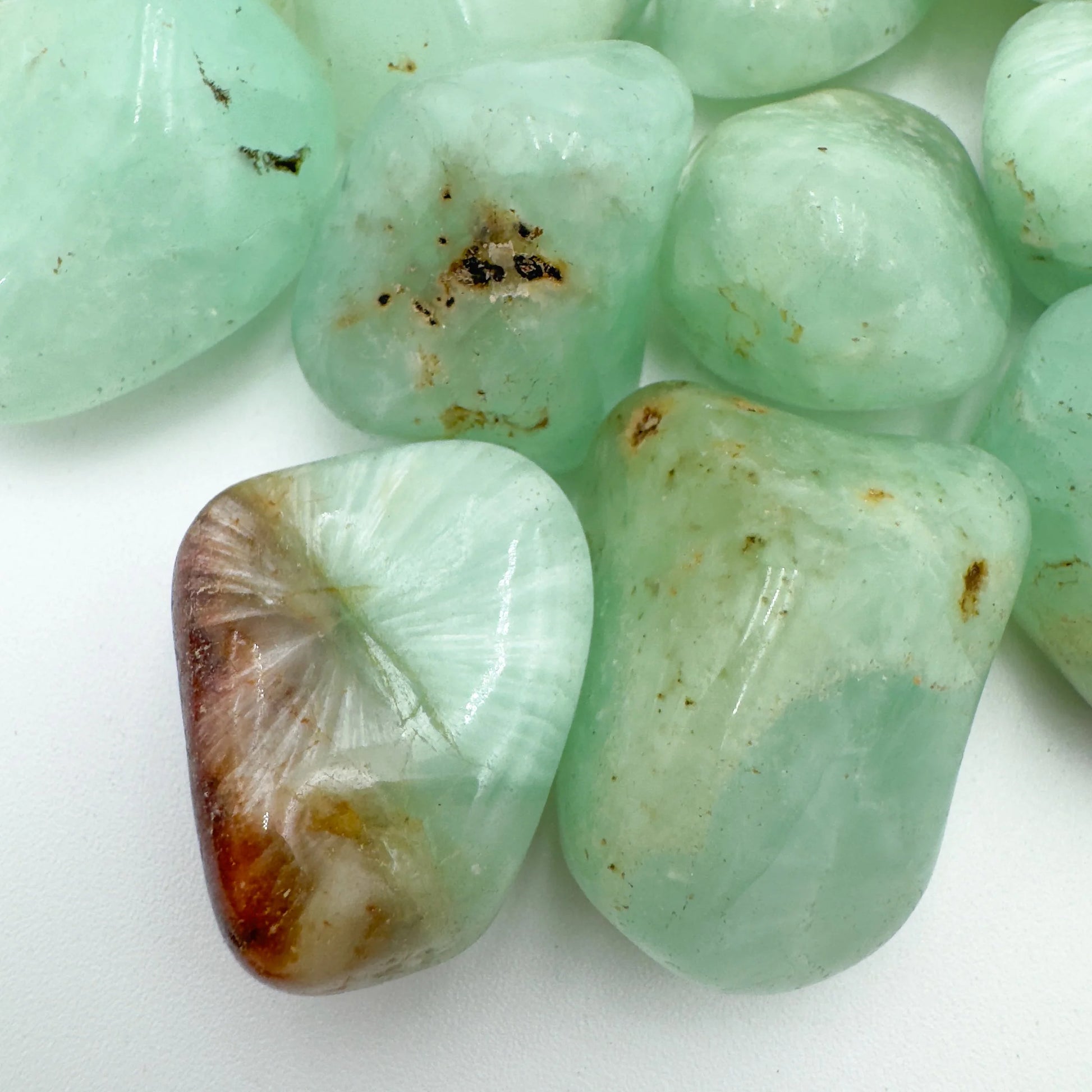 Top view of green Prehnite tumbled stone, sourced from Namibia.