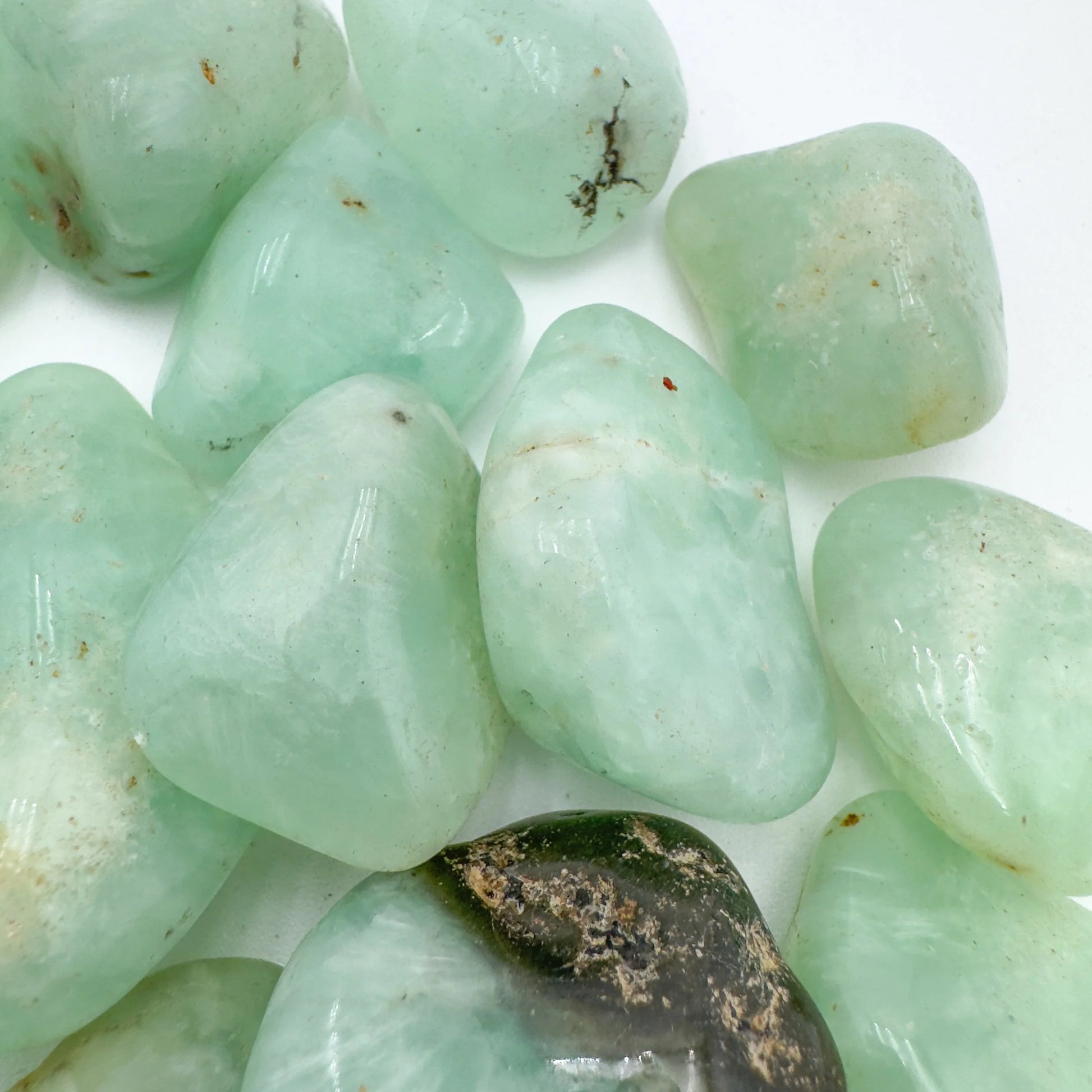 Full piece view of Prehnite tumbled stone, from Erongo, Namibia, shown for shape and scale.