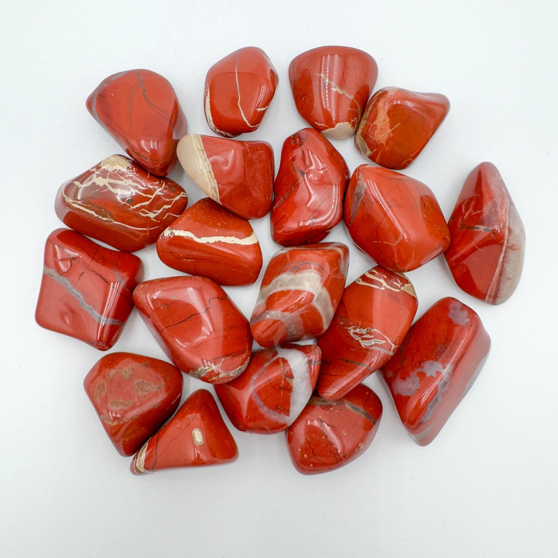 Close-up of Red Jasper tumbled stone from South Africa, soothing wellness stone for Confidence