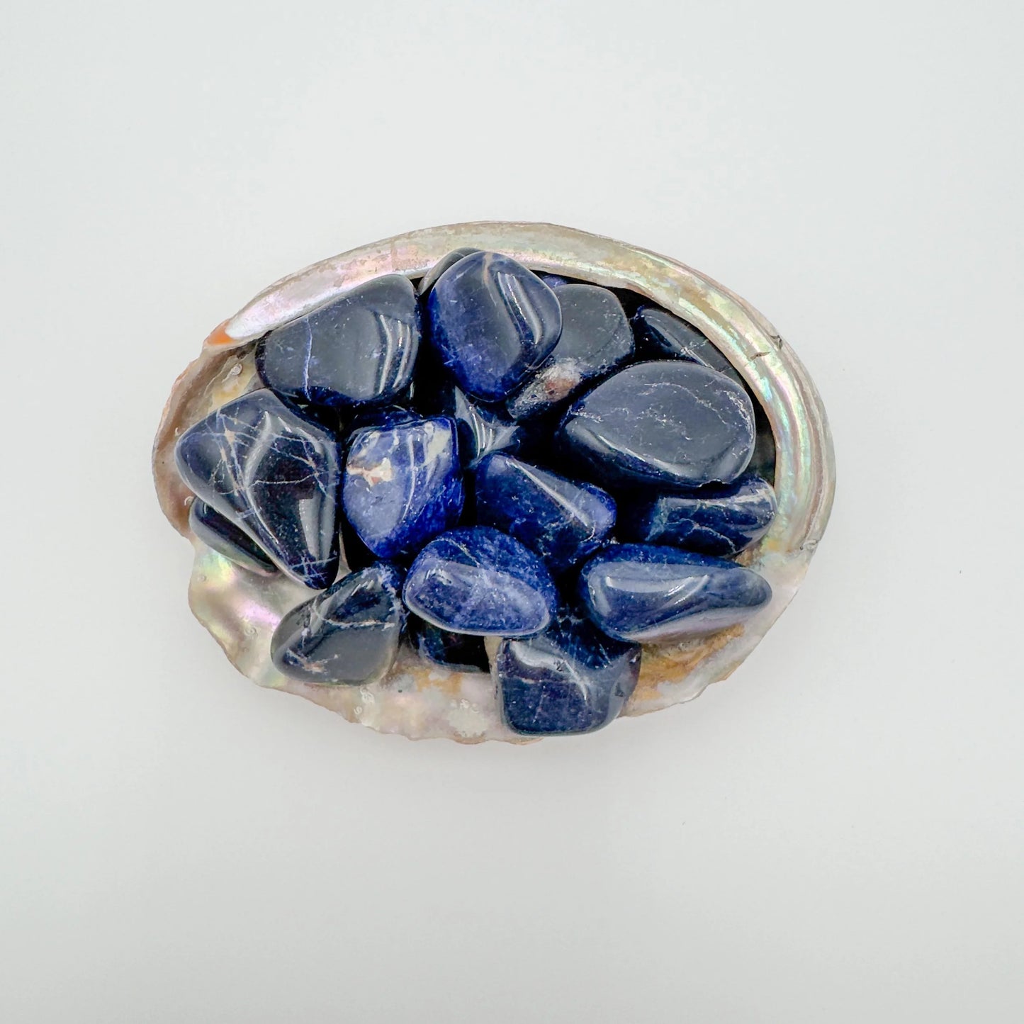 Surface detail of Sodalite tumbled stone, from Kunene, Namibia, often kept for Focus.