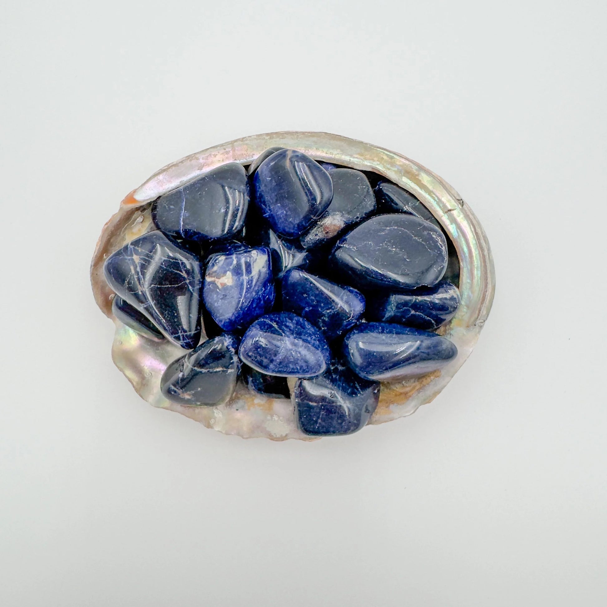 Surface detail of Sodalite tumbled stone, from Kunene, Namibia, often kept for Focus.