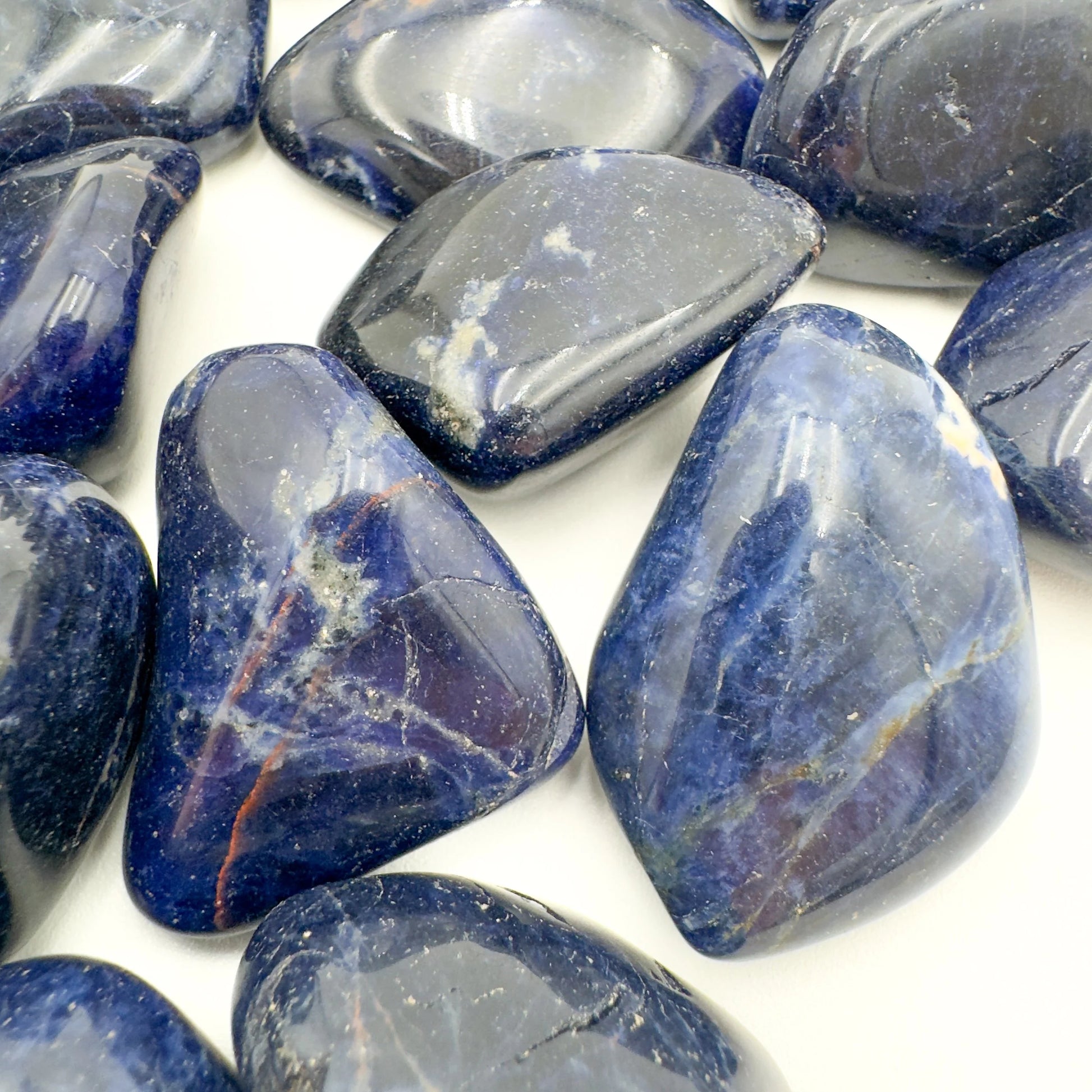 Bird's-eye view of Sodalite tumbled stone, showing translucent edges, from Kunene, Namibia.