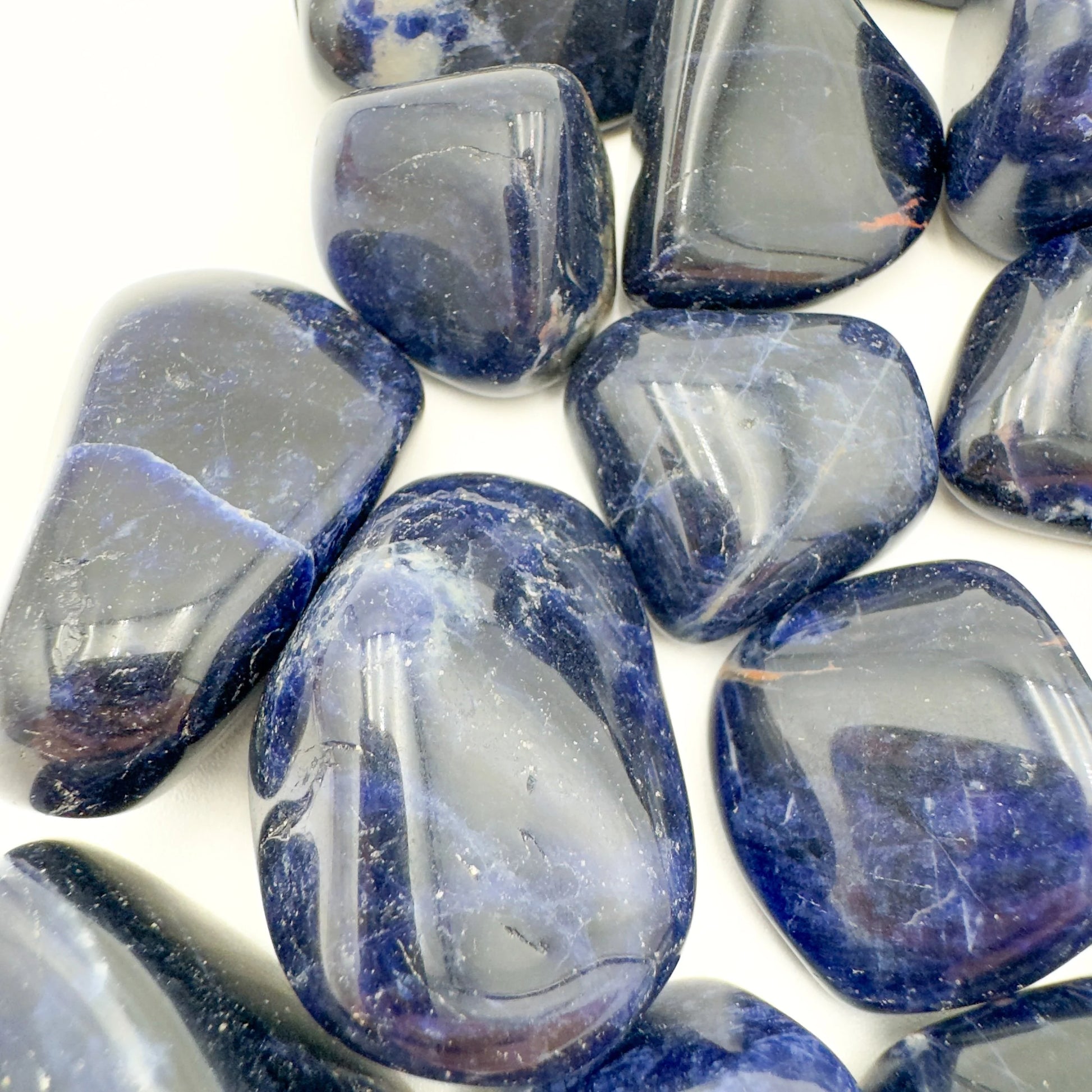 Underside detail of Sodalite tumbled stone, linked to Focus.