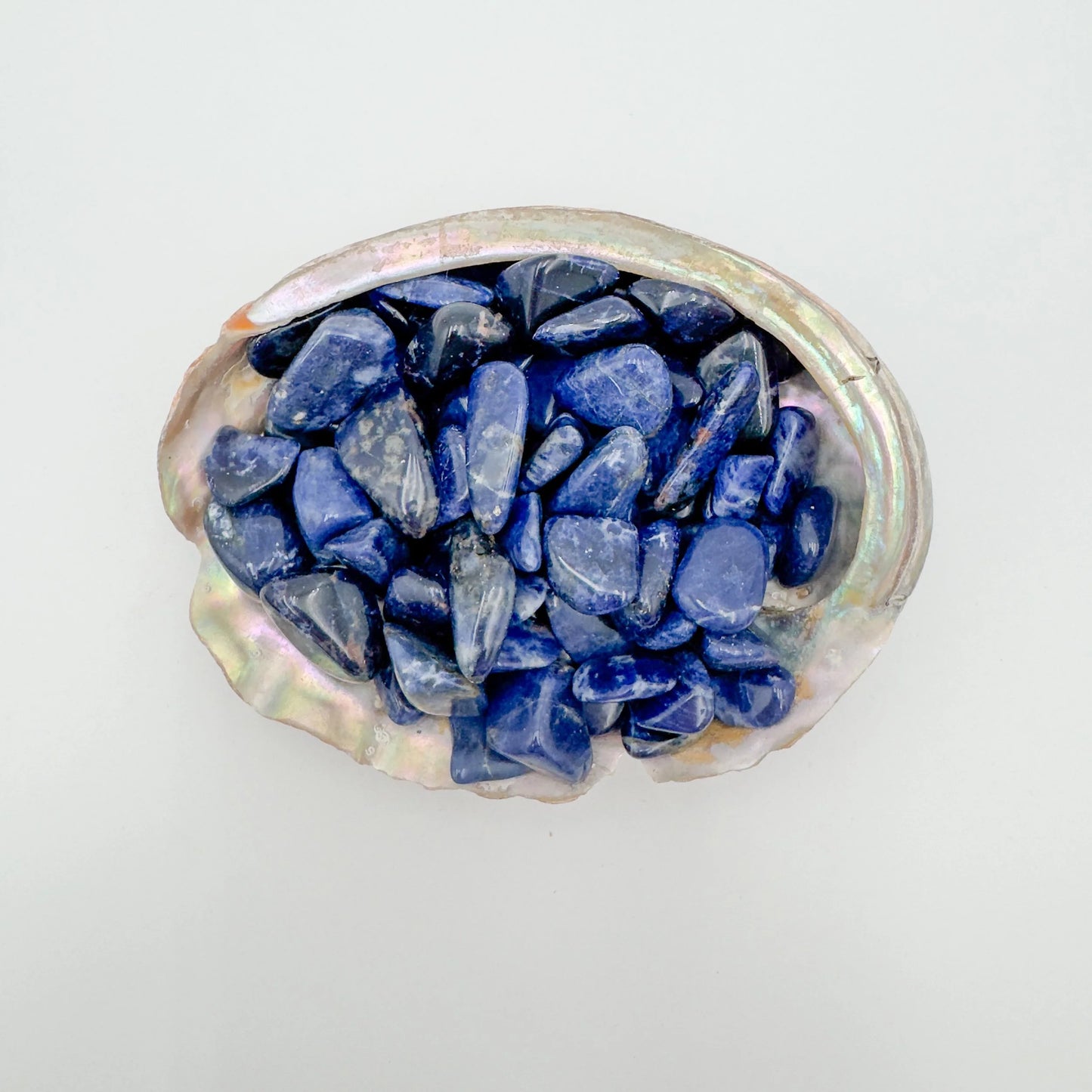 Up-close view of Sodalite tumbled stone, showing matte finish.