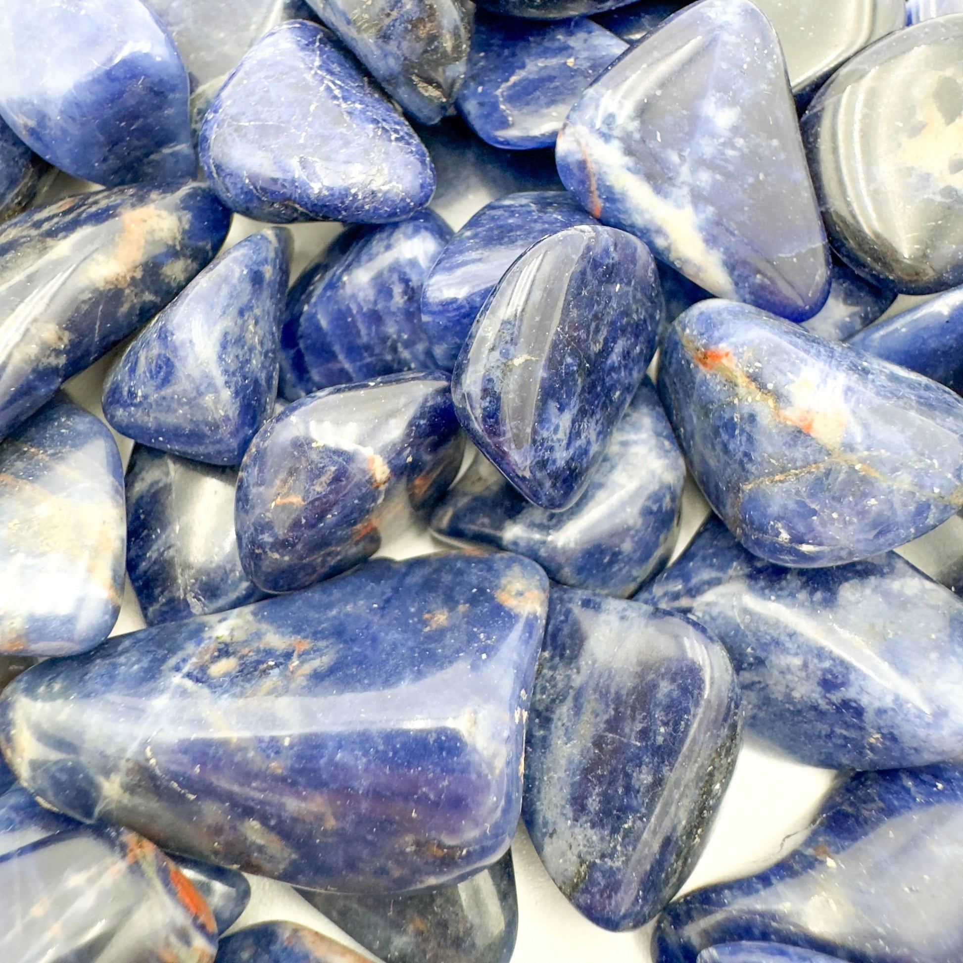 Overhead view of Sodalite tumbled stone, for Focus and Intuition, sourced from Namibia.