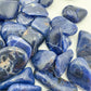 Rear view of Grade AA Sodalite tumbled stone, Namibia-sourced.