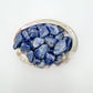 Detail of blue Sodalite tumbled stone, showing soft luster.