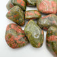 Side-on view of Unakite tumbled stone, drawn on for Emotional Healing and Healing.