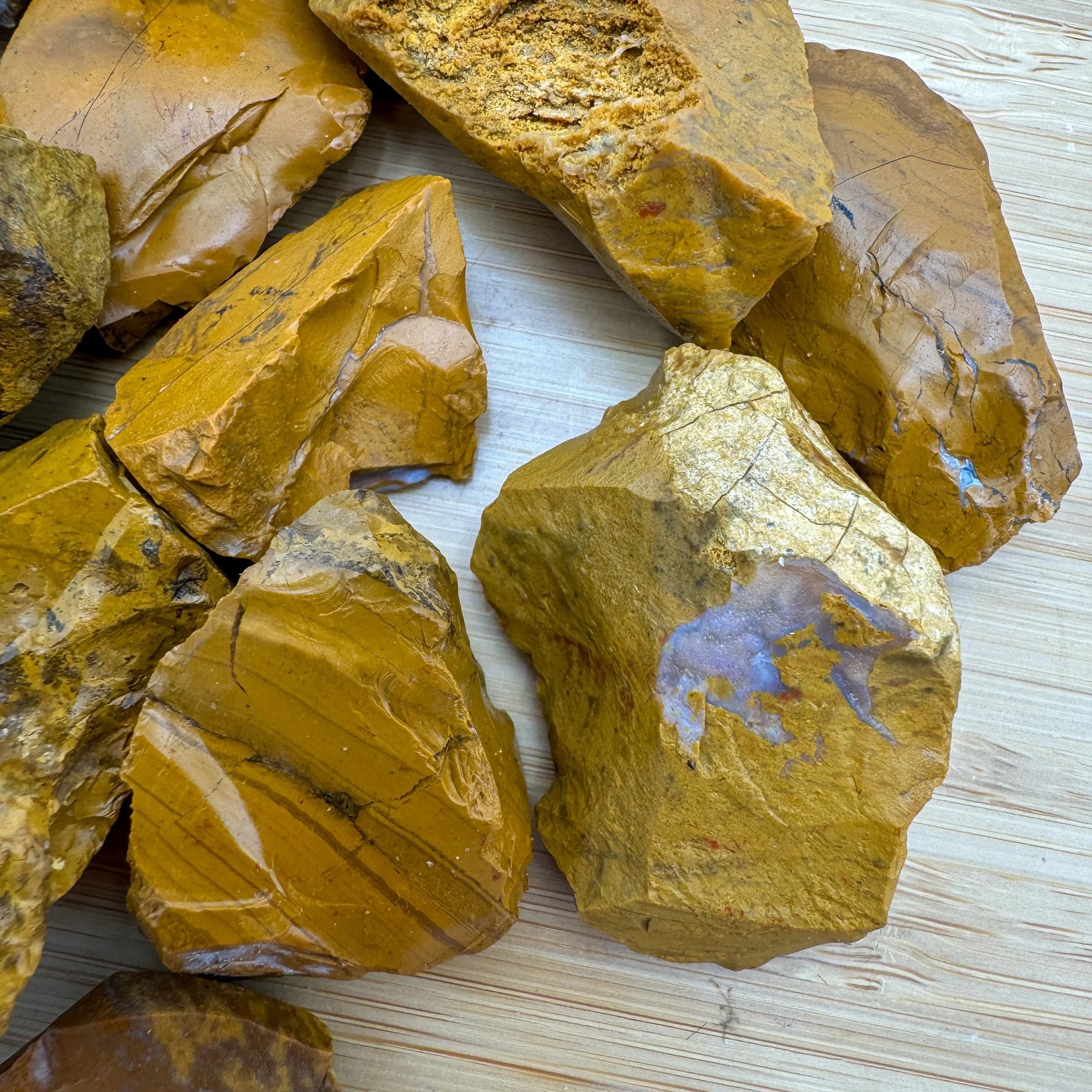 Alternate angle of Yellow Jasper raw stone, carried for Confidence, showing natural color depth.