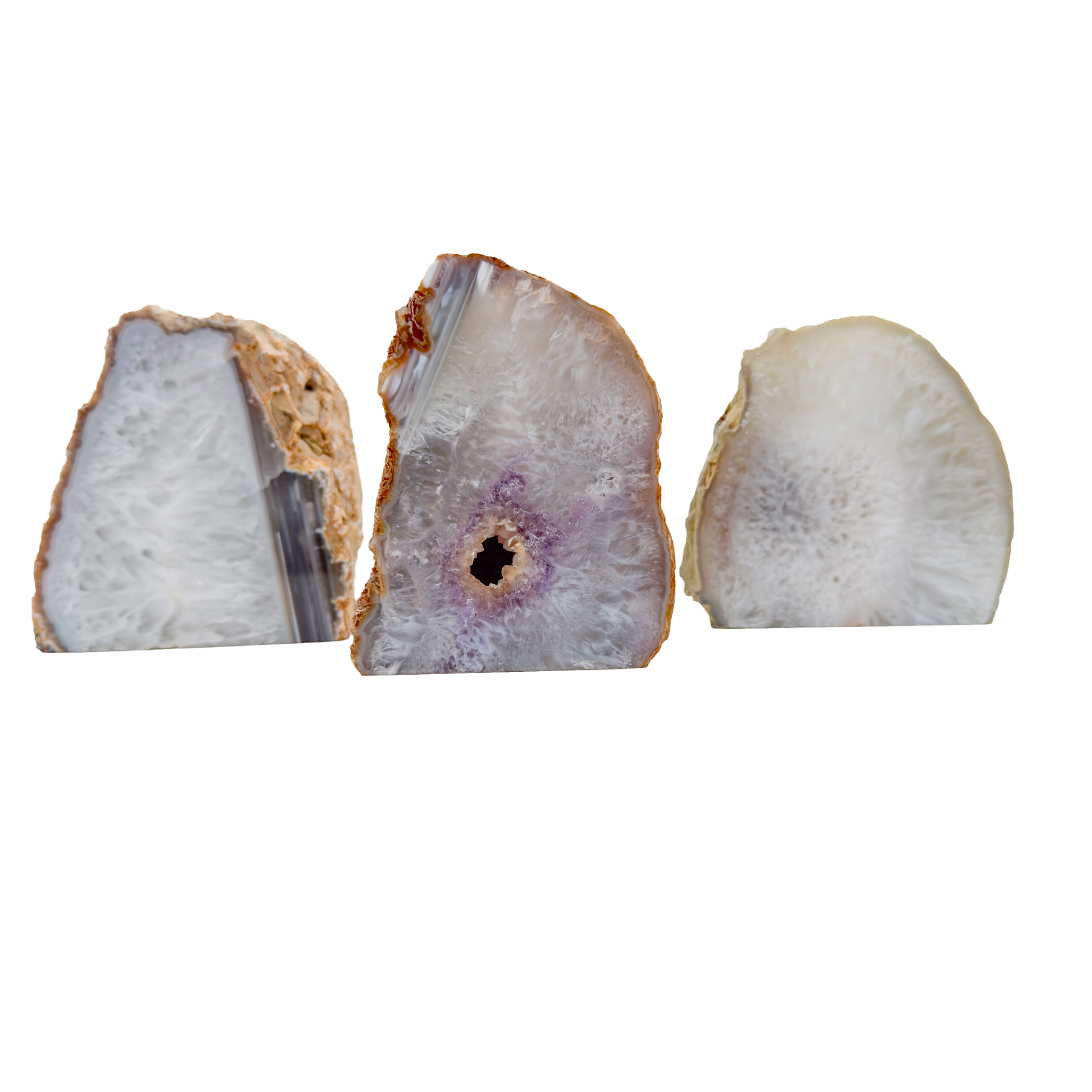 Three standing agate candle holders from Brazil with polished banded faces and natural rind