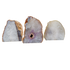 Three standing agate candle holders from Brazil with polished banded faces and natural rind