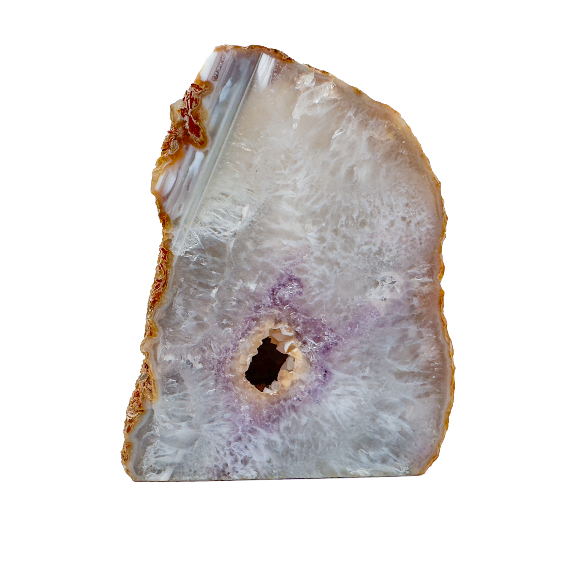 Agate candle holder with a natural vug opening and violet wash across the polished face