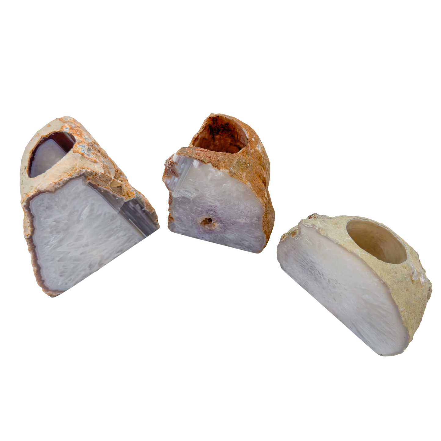 Agate candle holders tipped forward showing the drilled wells sized for standard tea lights