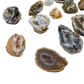 Close grouping of multicolored Agate geodes from Minas Gerais, banded patterns formed in volcanic cavities