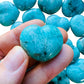 Studio-style view of Amazonite stone, from Amboasitra, Madagascar, with character of the piece on display.