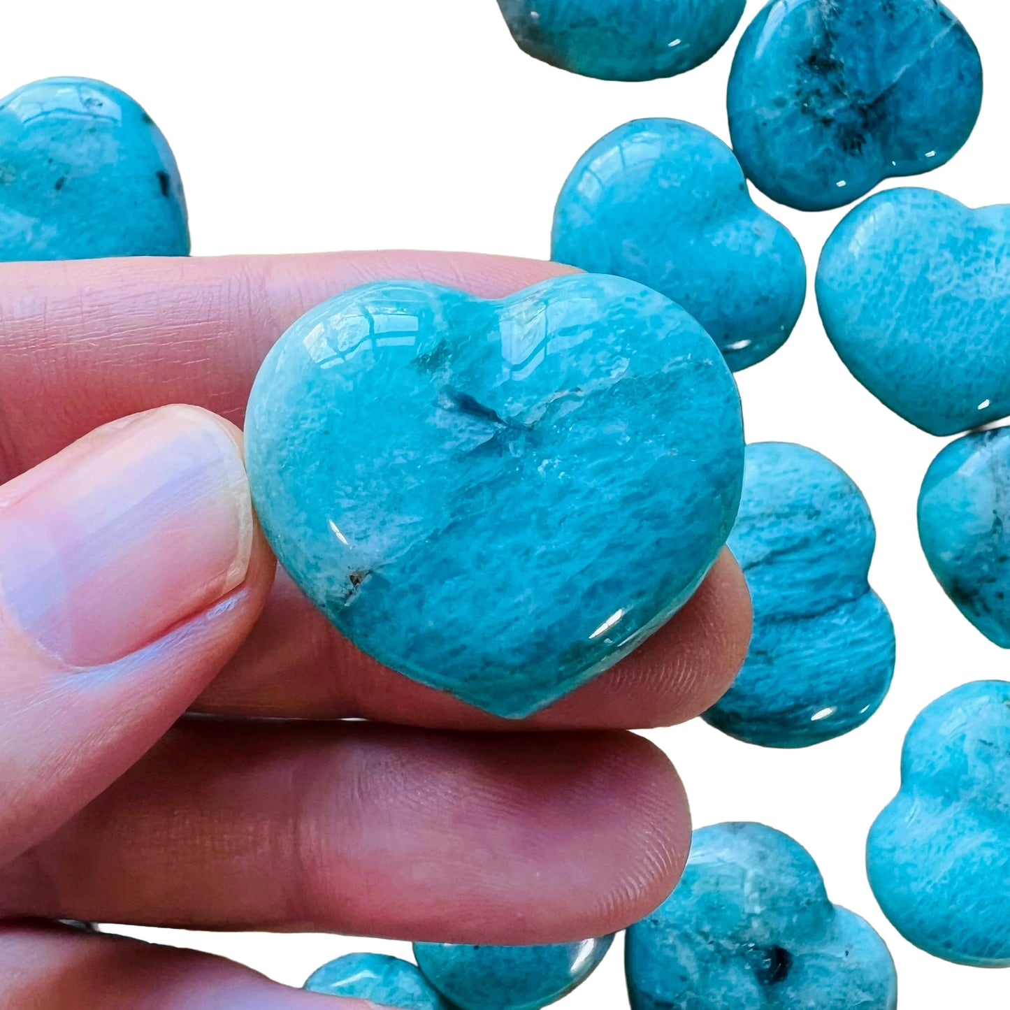 Detail shot of Grade AA Amazonite heart under natural light.