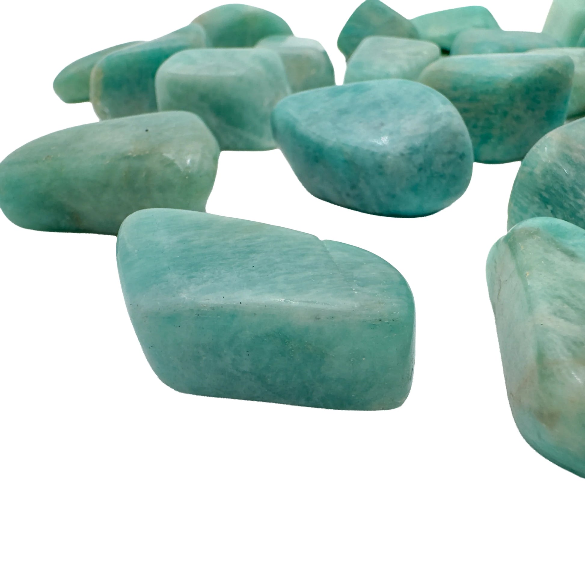 Close-up of polished blue-green Amazonite tumbled stones from Mozambique